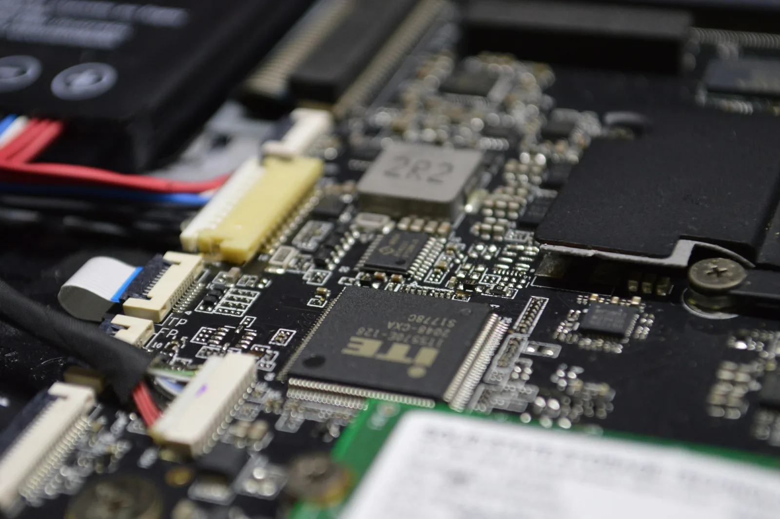 Close-up of a laptop motherboard during hardware diagnostics